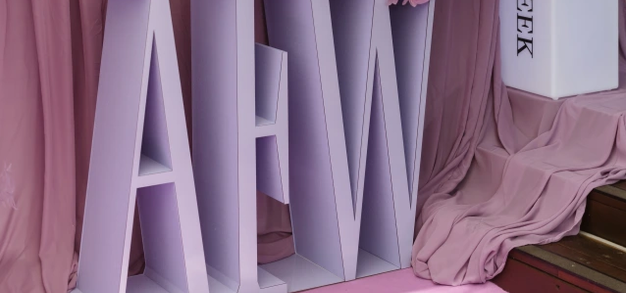 AFW in giant letters with a large lilac coloured bouquet sitting on top