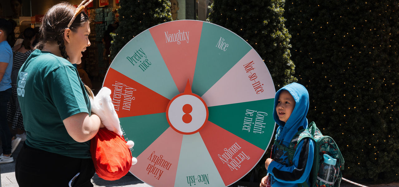 Child at the spinning wheel smiling