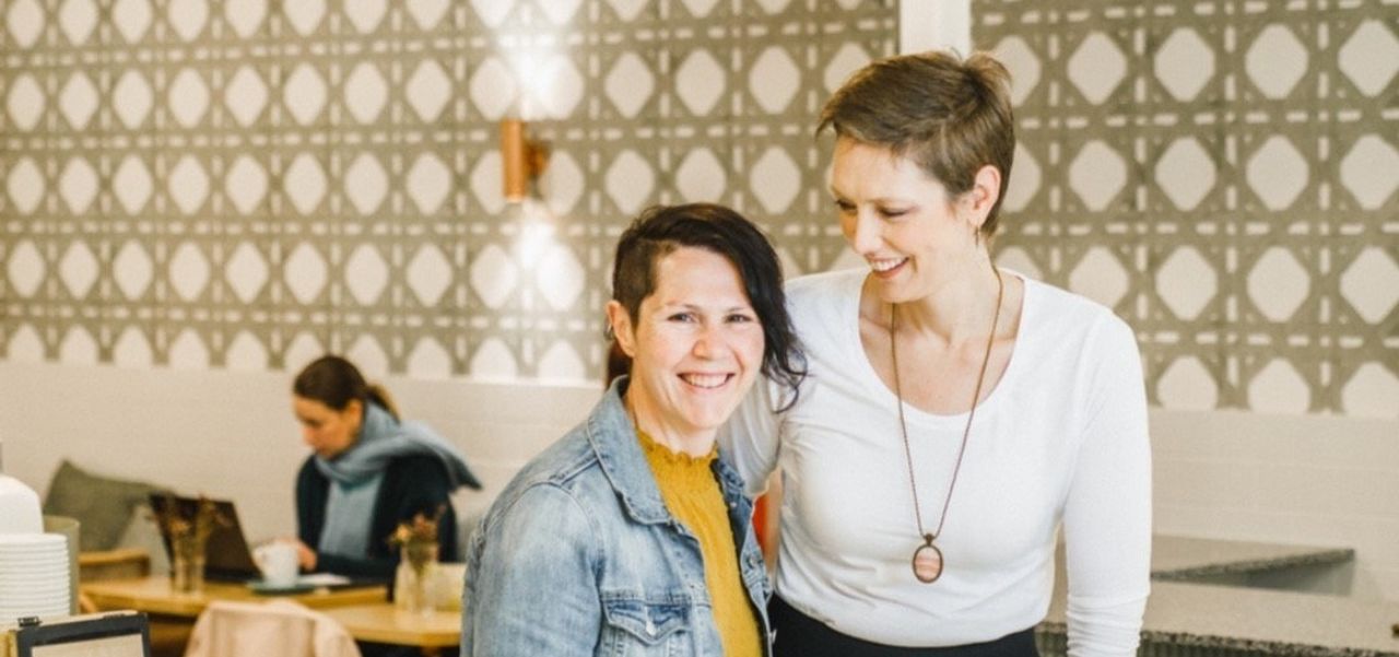 Let Them Eat owners Tanya and Danielle standing together in their James Place store.