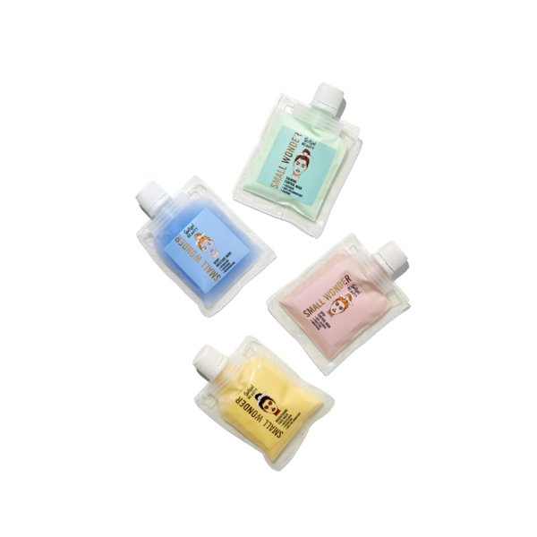 four pouches of face masks in green, blue, pink and yellow