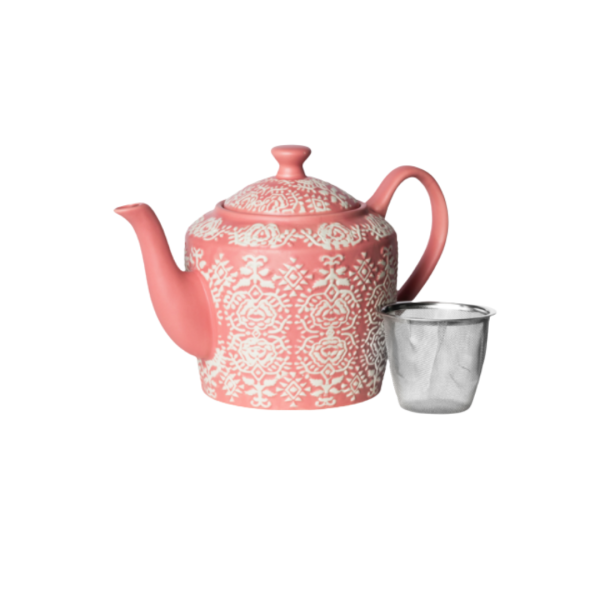 A pink teapot and filter with white etching