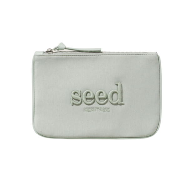 A pale green jersey small pouch with the word seed embroidered on the front