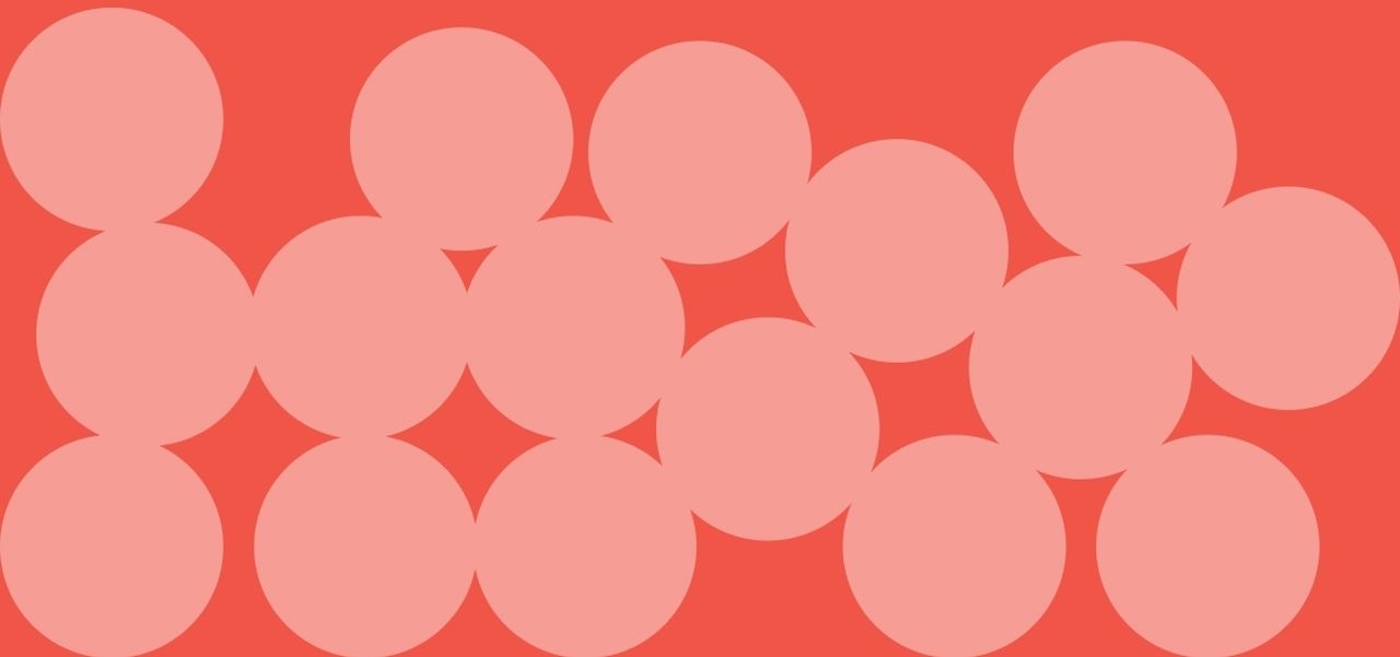 A red background with moving peach circles