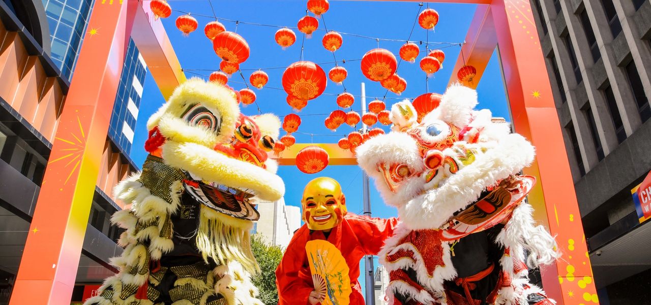 Lion dancers and god of fortune in Rundle Mall