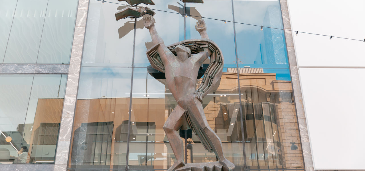 The front facade of Rundle Mall Plaza showing the Progress sculpture