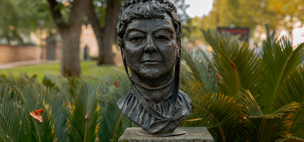 A metal bust of a woman