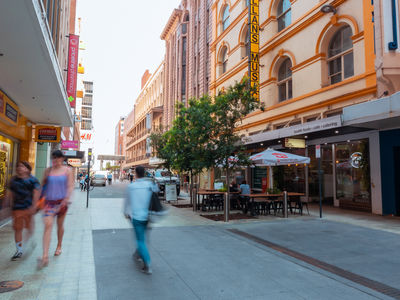 Blurred people walking through Gawler Place