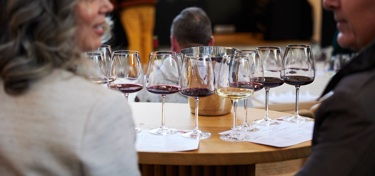 An array of glasses set up for a wine tasting