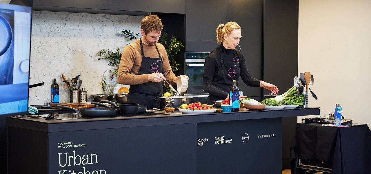 Two chefs preparing vegetables