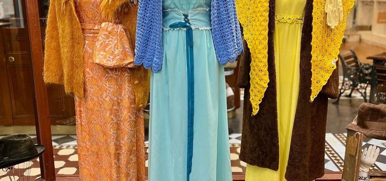 Dulcie's Vintage clothes on three mannequins in their front window