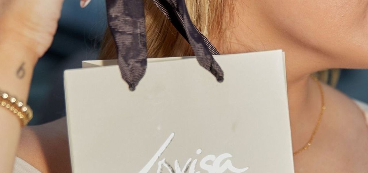Person holding Lovisa bag with jewellery