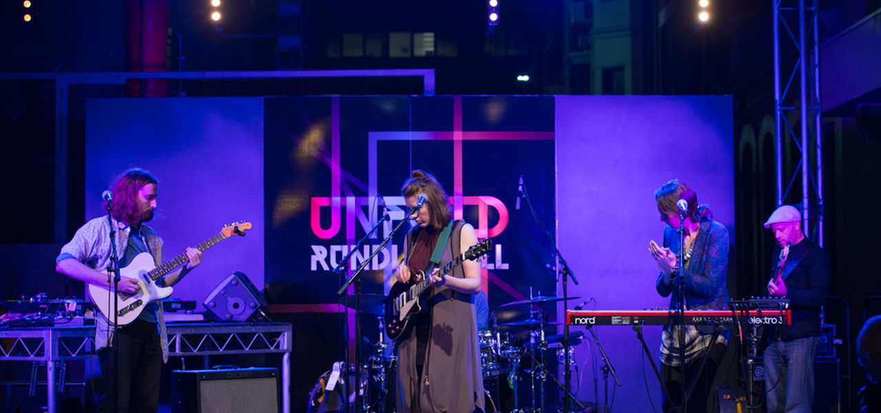 A band playing guitars
