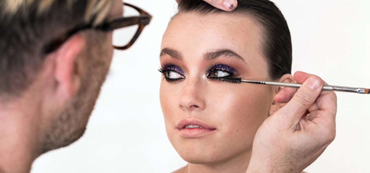 Woman having her make up done
