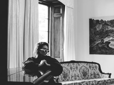 A woman sitting at a piano